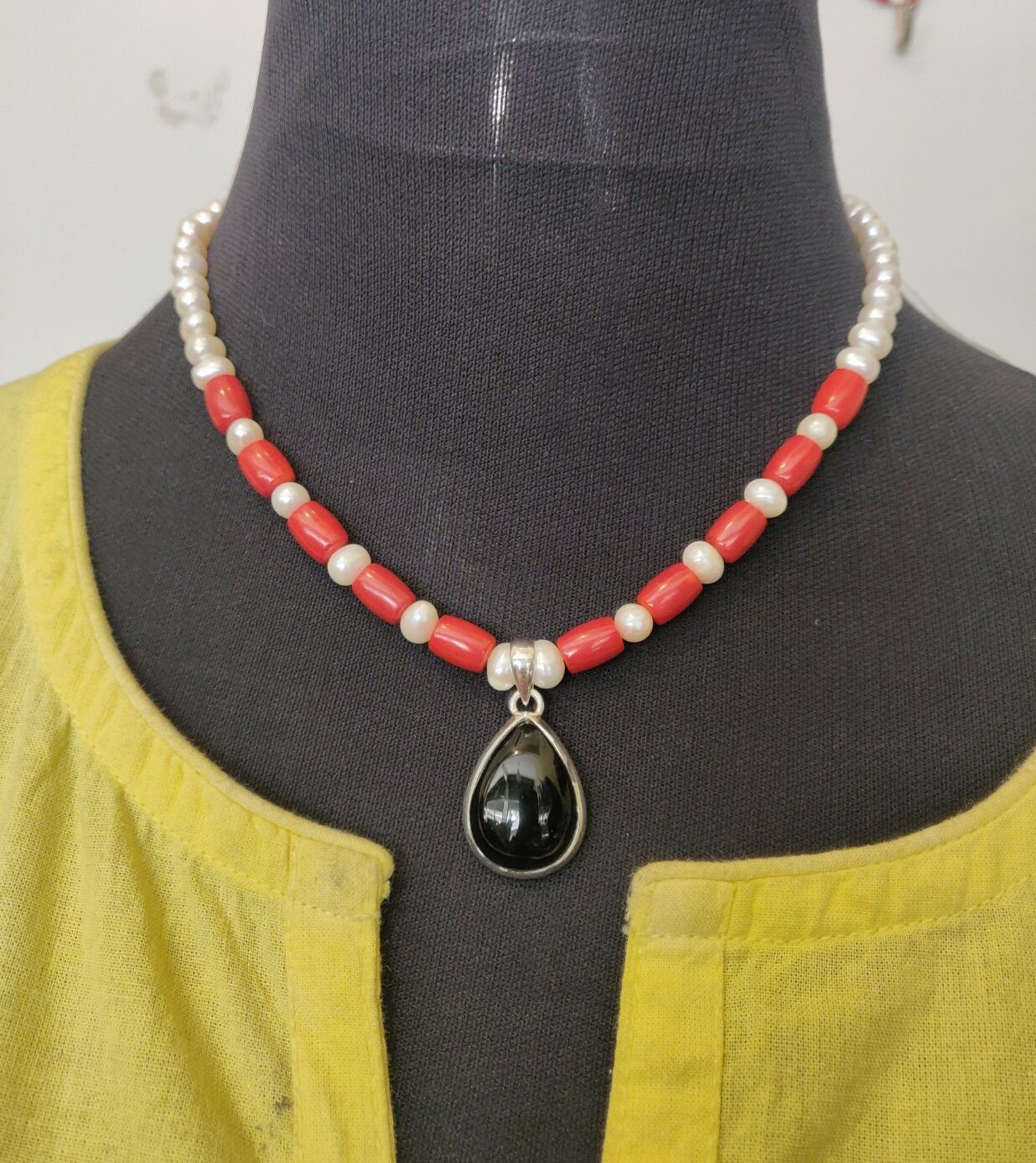 Fresh water pearls and coral necklace with Onyx silver Pendant