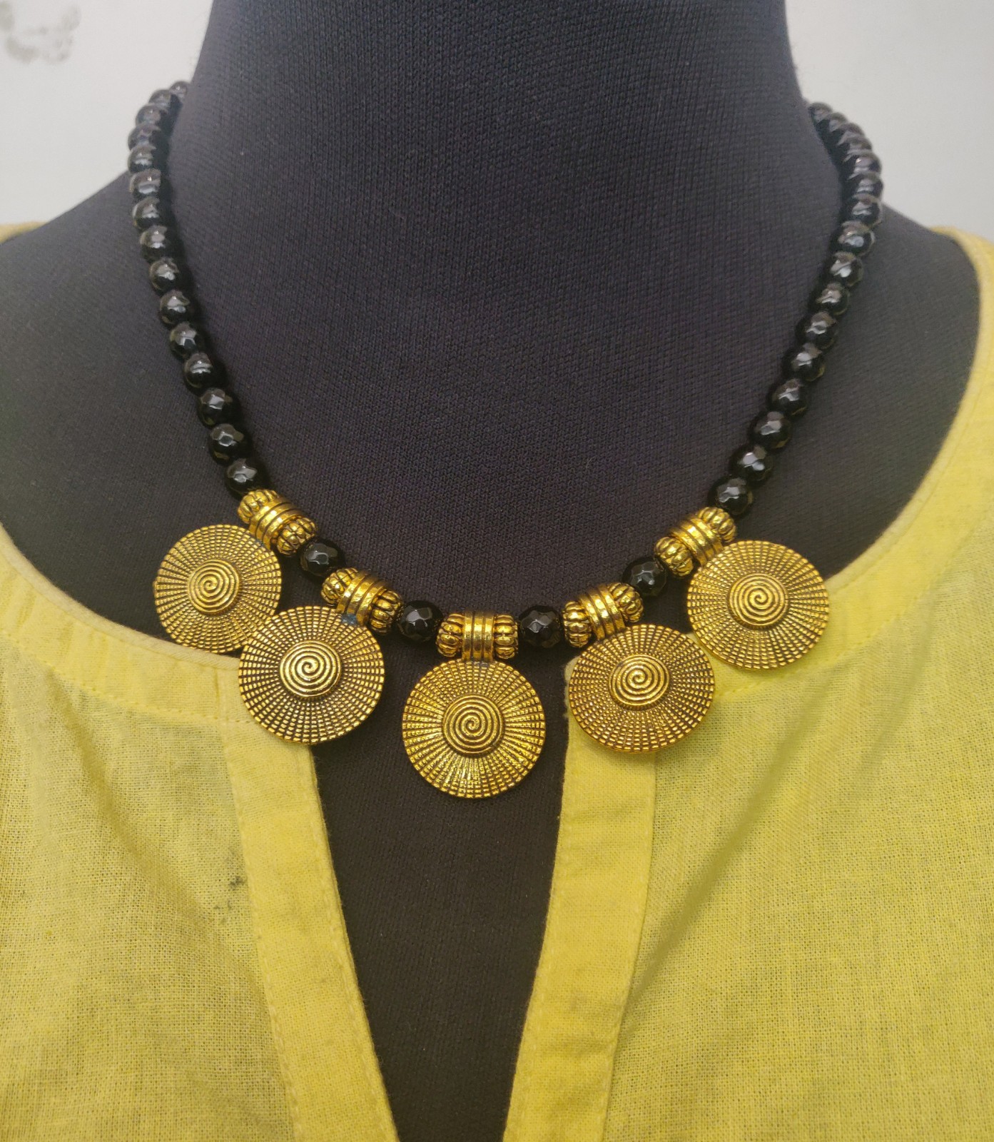 Black beads with gold charms necklace