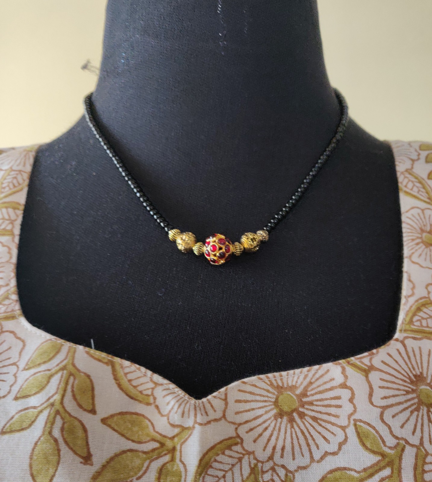 Necklace with Black beads, brass beads and kempu bead