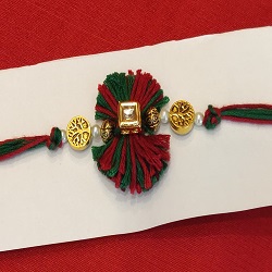Kundan, brass beads and thread rakhi