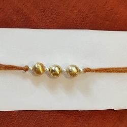 Simple gold beads rakhi