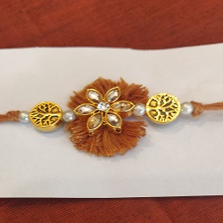 Thread and metal flower rakhi