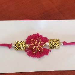 Thread and metal flower rakhi