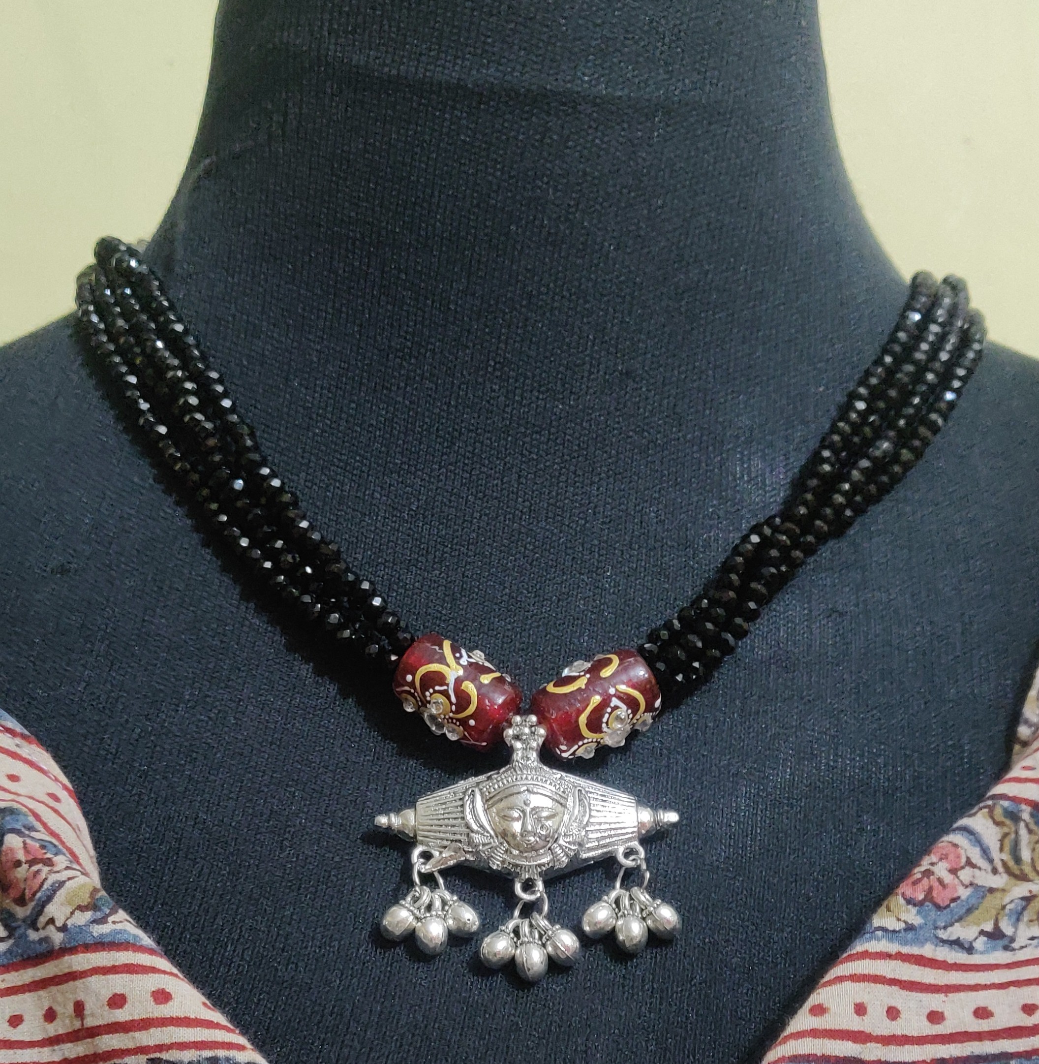 Layered black crystal beads and Durga pendant necklace