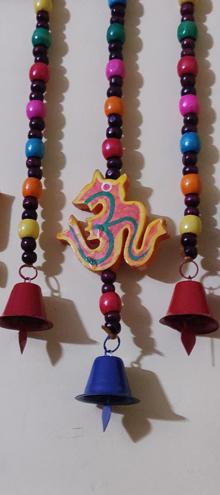 Handmade wall hanging with wooden OUM, round Beads with metal bells