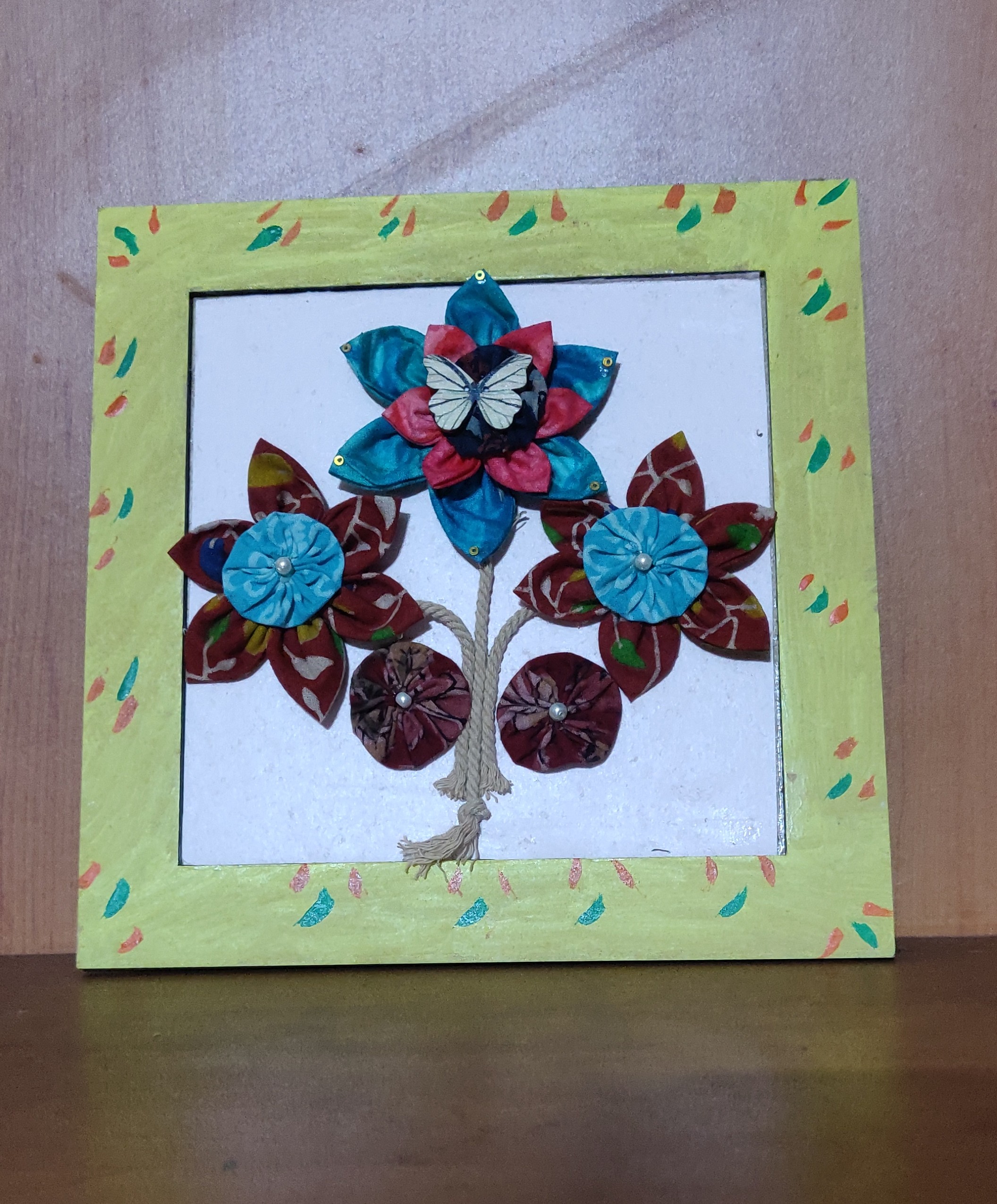 Wooden frame with fabric flowers