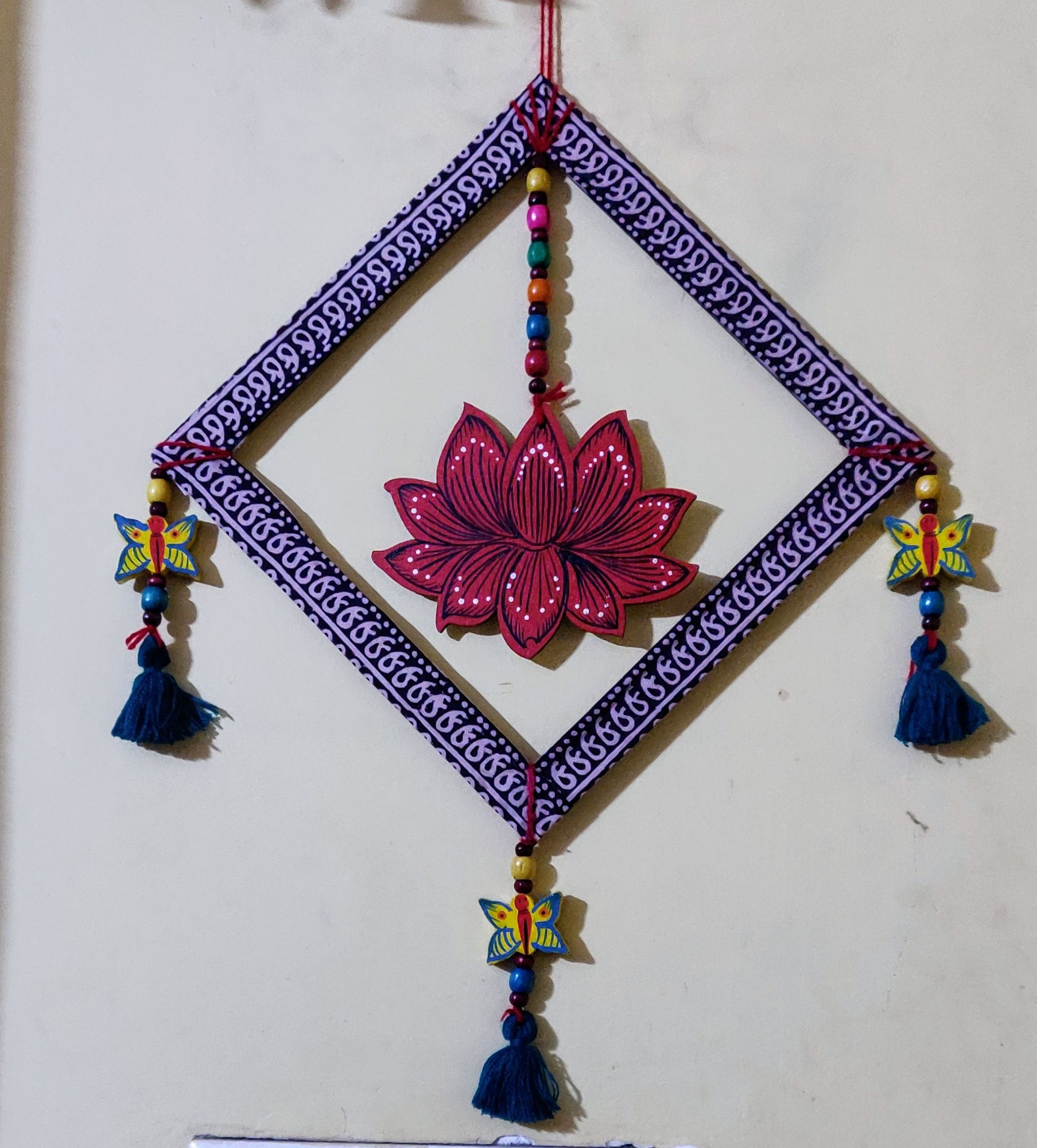 Wooden frame with wooden beads