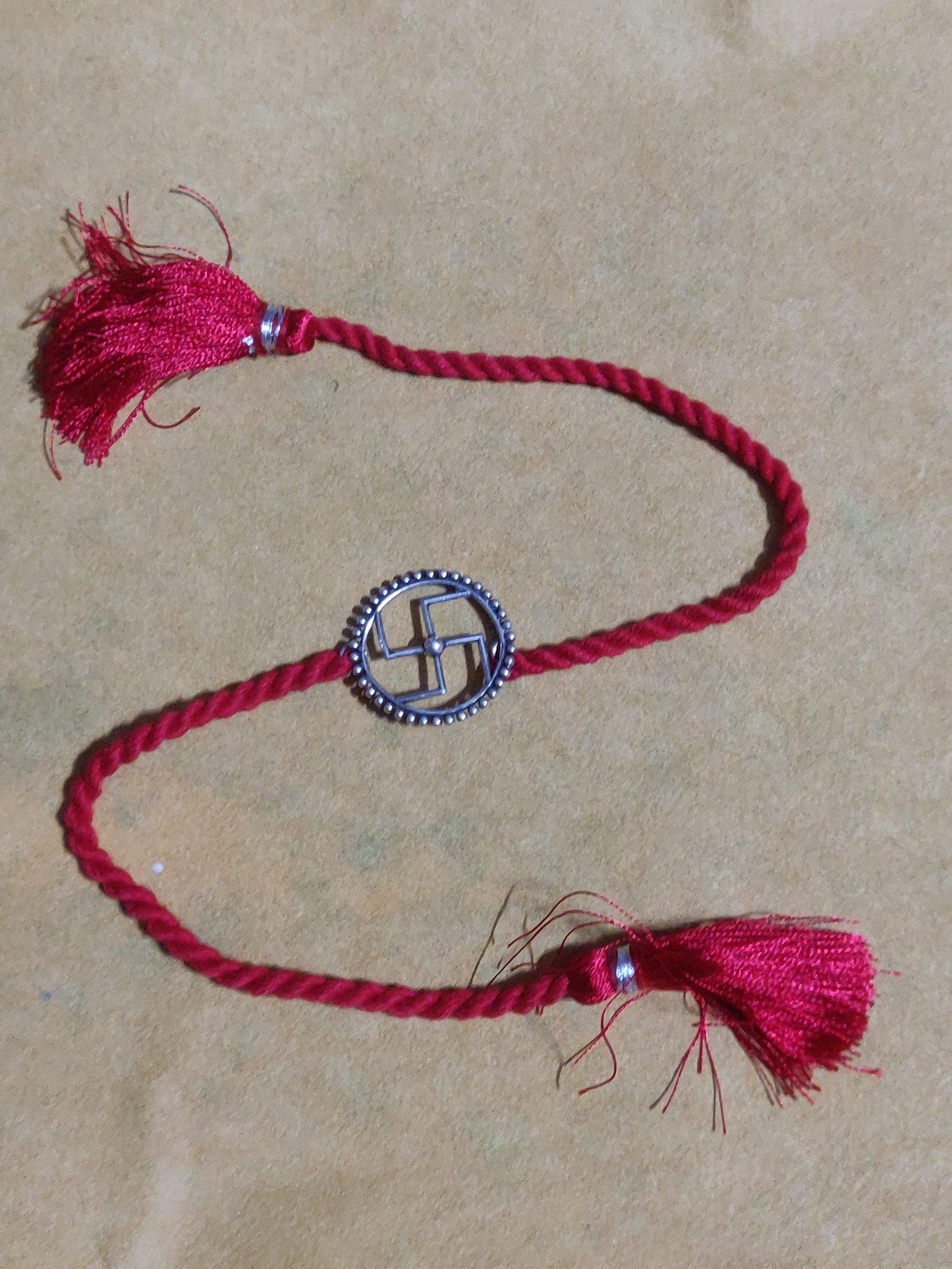 Pure silver swastik rakhi