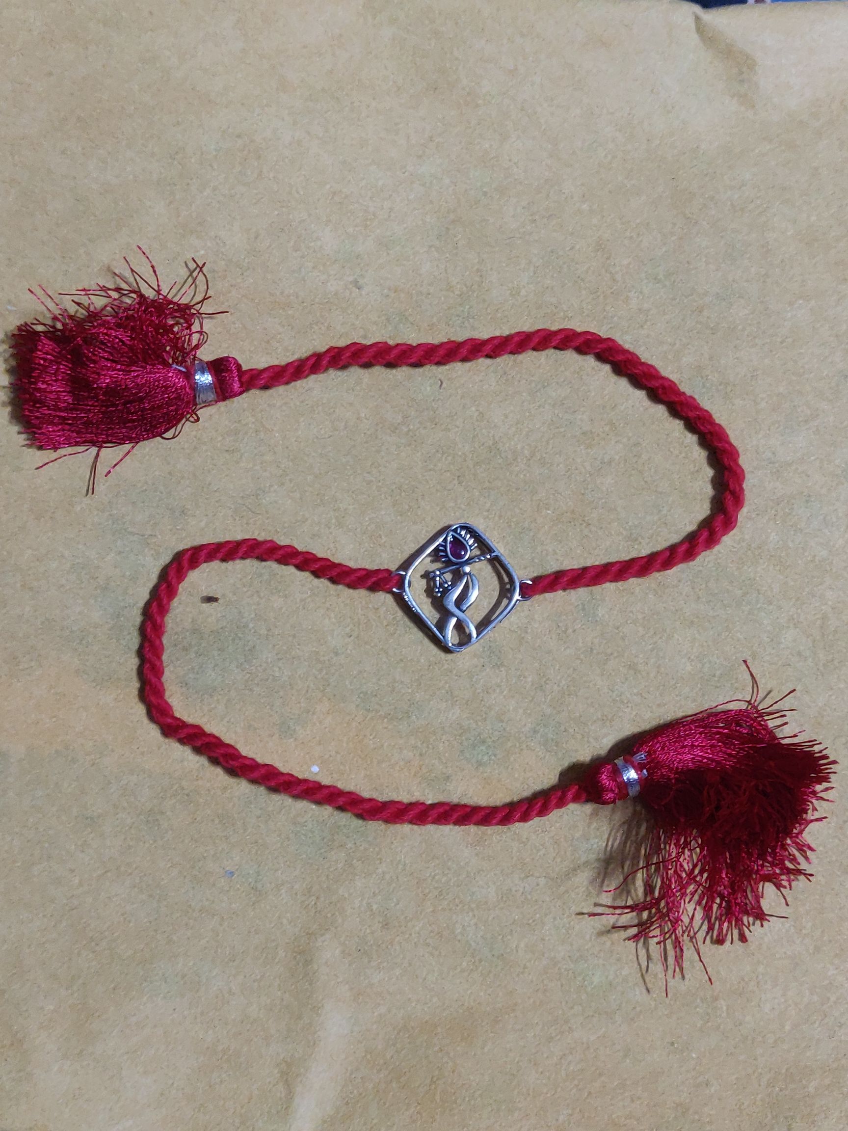 Pure silver murali rakhi